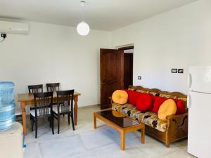 a living room with a couch and a table at Adriatic Hostel Vlora in Vlorë