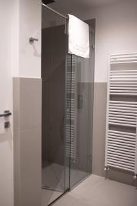 a bathroom with a shower with a glass door at DaNina in Verona