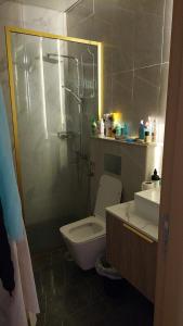 a bathroom with a toilet and a sink at Sunrise Dubai in Dubai