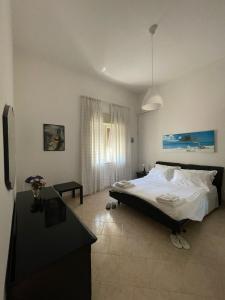Ένα ή περισσότερα κρεβάτια σε δωμάτιο στο Villa Carmela a San Pietro in Bevagna (TA)