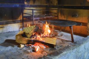 a pot over a fire in a brick oven at Villa Lena in Bihać +90 photos
