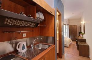 A kitchen or kitchenette at Enalion Hotel