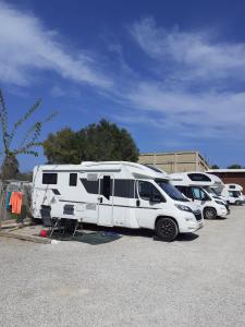 a group of rvs parked in a parking lot at Bungalows Park Albufera in El Saler