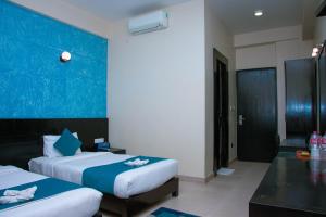 Krevet ili kreveti u jedinici u okviru objekta Tuki Resort Pokhara