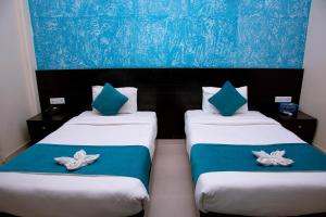 Krevet ili kreveti u jedinici u okviru objekta Tuki Resort Pokhara