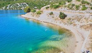 an aerial view of a beach with blue water at Apartman Zaton in Zaton