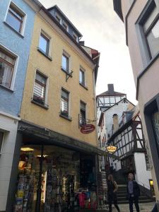 a store in front of a building in a city at Meyver Cochem Centrum. in Cochem