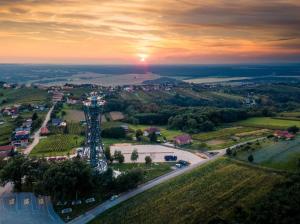an aerial view of a city with a radio tower at Landena Apartments Lendava in Lendava