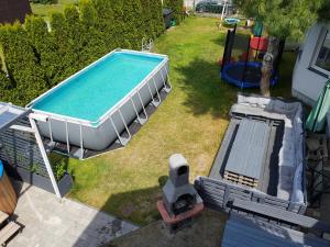 an overhead view of a swimming pool in a yard at Balaton Rowy in Rowy