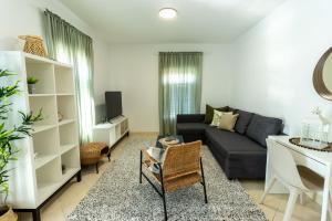 a living room with a couch and a table at LUXURY STYLISH APARTMENT BURE in Murter