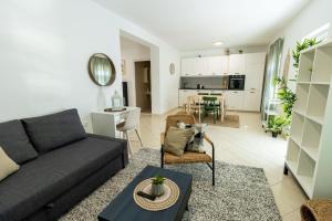 a living room with a couch and a table at LUXURY STYLISH APARTMENT BURE in Murter