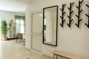a mirror on a wall next to a door at LUXURY STYLISH APARTMENT BURE in Murter