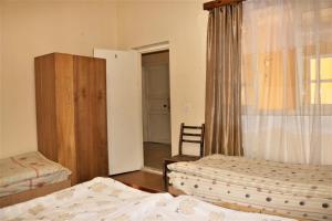 Voodi või voodid majutusasutuse Taoskari Hotel toas