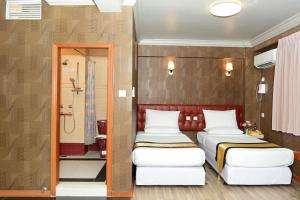 Postel nebo postele na pokoji v ubytování Hotel Grand United - Chinatown