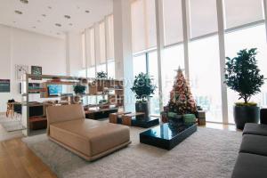 a living room with a christmas tree in the middle at #4 KLCC Platinum Suites (Face Suites) 1BED 1BATH in Kuala Lumpur
