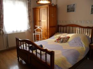 Кровать или кровати в номере Chambre chez l'habitant