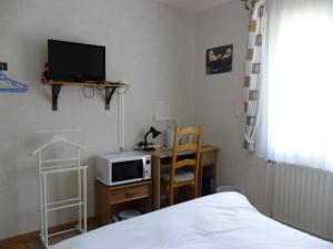 TV a/nebo společenská místnost v ubytování Chambre chez l'habitant + 8 fotografií