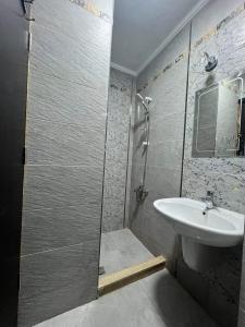 a bathroom with a shower and a sink at Sia crystal lagoons - Golf Porto marina- الساحل الشمالي -العلمين in El Alamein