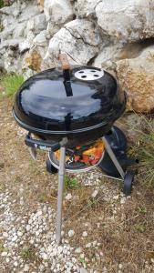 a grill with a face on top of it at Studio Apartment Sanja 3 in Neum