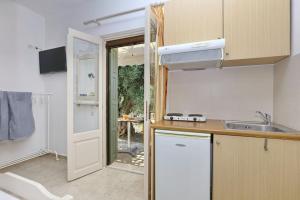 a kitchen with a sink and a counter top at Doma-Stafylos 2 in Skopelos Town