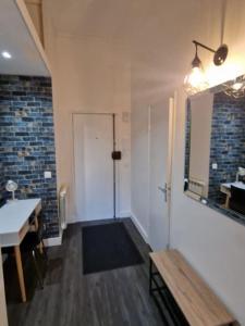 a bathroom with a shower and a bench and a sink at CASITA aux portes de paris in Bagneux