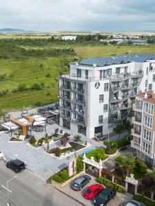 an aerial view of a building with a parking lot at хотел ADDRESS in Ravda