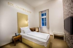 Postel nebo postele na pokoji v ubytování Rimske Terme Resort - Hotel Sofijin dvor + 13 fotografií