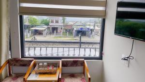 a view of a street from a window with a table at Hotel Bảo Quang in Phú Khê (2)