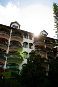 a very tall building with a lot of windows at Strawberry Park Resort in Cameron Highlands