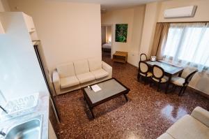 a living room with a couch and a table at Luxury Apartment in Plaka - Acropolis (Luisa) in Athens