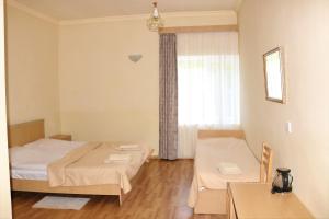 Voodi või voodid majutusasutuse Taoskari Hotel toas