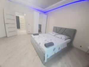Postel nebo postele na pokoji v ubytování Graf Apartnents1