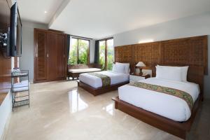 Postel nebo postele na pokoji v ubytování Ubud Wana Resort + 37 fotografií