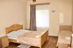 Voodi või voodid majutusasutuse Taoskari Hotel toas