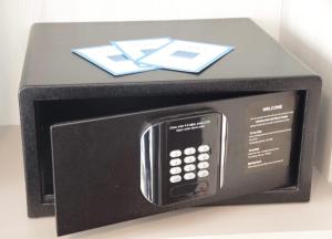 a microwave with a cell phone inside of it at The Exiles Hotel in Sliema