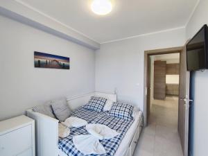 Posteľ alebo postele v izbe v ubytovaní Lakeside Family & Studio Apartments