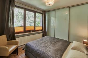 En eller flere senge i et værelse på Apartamenty Świnoujście - Beach-Home - Chodorowskiej 24 5