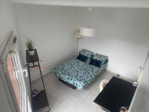 Posteľ alebo postele v izbe v ubytovaní Appartement T3 climatisé,balcon