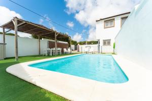 a swimming pool in the backyard of a house at Chalet Privado Rural Barbate in Barbate
