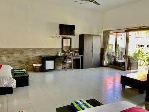 a large living room with a kitchen and a living room at Liberty Dive Resort in Tulamben