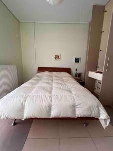 Postel nebo postele na pokoji v ubytování Beautiful and comfortable apartment by the sea