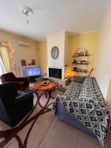 TV a/nebo společenská místnost v ubytování Beautiful and comfortable apartment by the sea