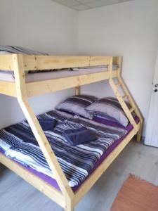 a bunk bed in a room with a bunk bedscribed at Apartmány Vihorlat III in Kaluža