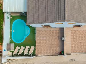 an overhead view of a building with a group of chairs at Chalet Privado Rural Barbate in Barbate +2 photos