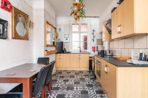 a kitchen with a table and a dining room at Hideaway in the centre of Brighton in Brighton & Hove