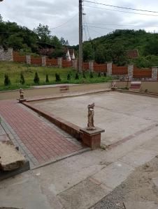 a courtyard with two fire hydrants in the middle at Casa Dragoi din Socolari, 218, Caras - Severin in Socolari