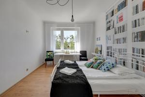 Un ou plusieurs lits dans un hébergement de l'établissement Amber Baltic by Grand Apartments