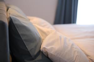 Postel nebo postele na pokoji v ubytování Mint Apartment