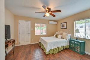 a bedroom with a bed and a ceiling fan at Inviting Poway Studio with Patio and Gas Grill! in Poway