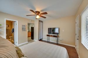 a bedroom with a ceiling fan and a television at Inviting Poway Studio with Patio and Gas Grill! in Poway